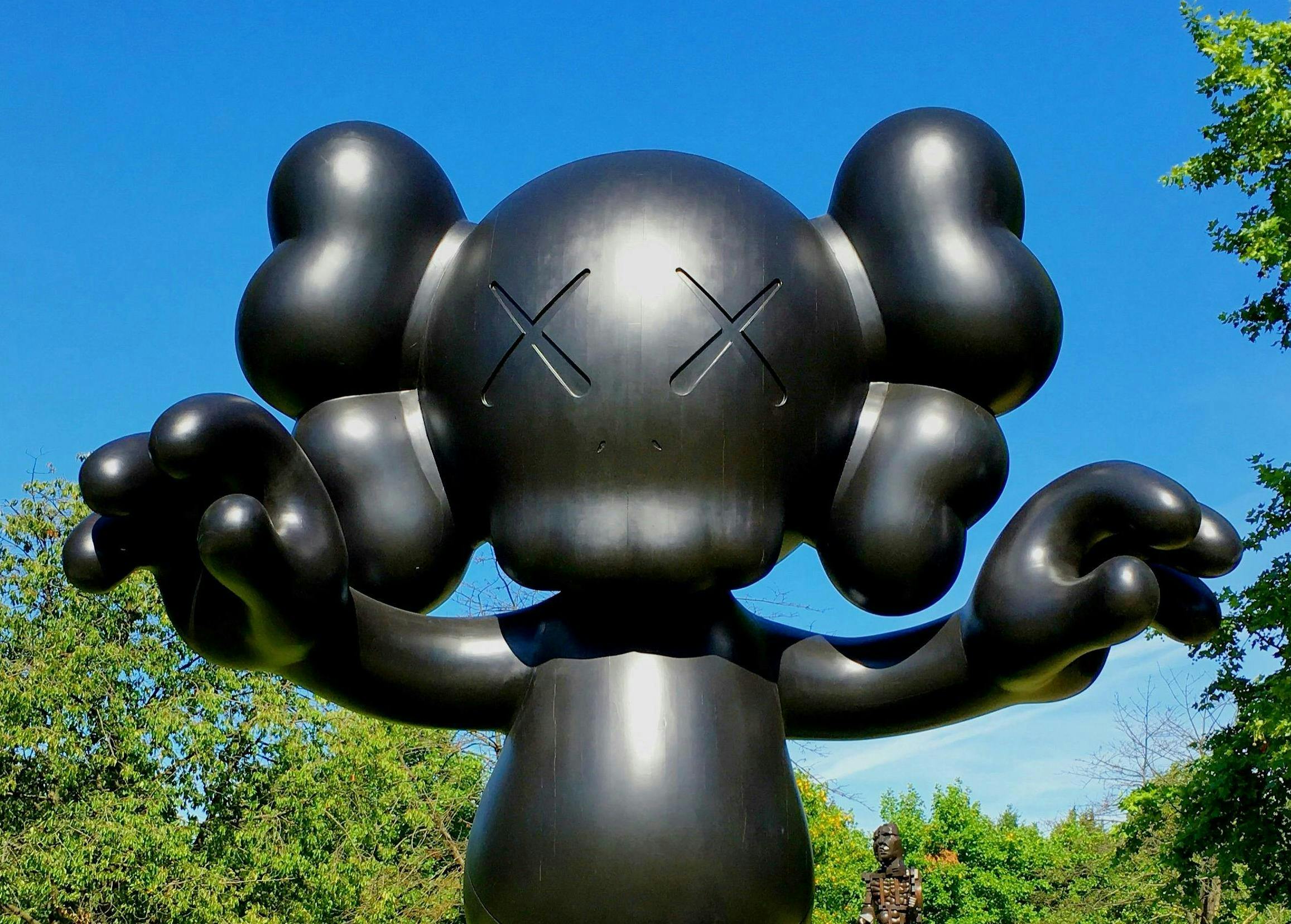 A statue and installation piece of the artist KAWS