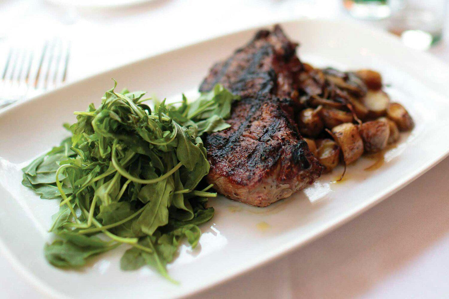 Steak dinner in the Hamptons with a side of greens