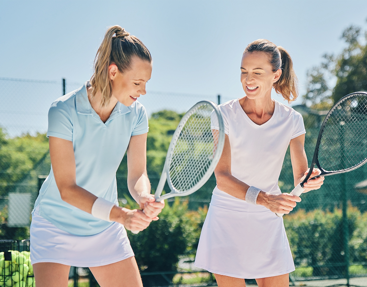 Southampton tennis school - 2 women holding a tennis racket
