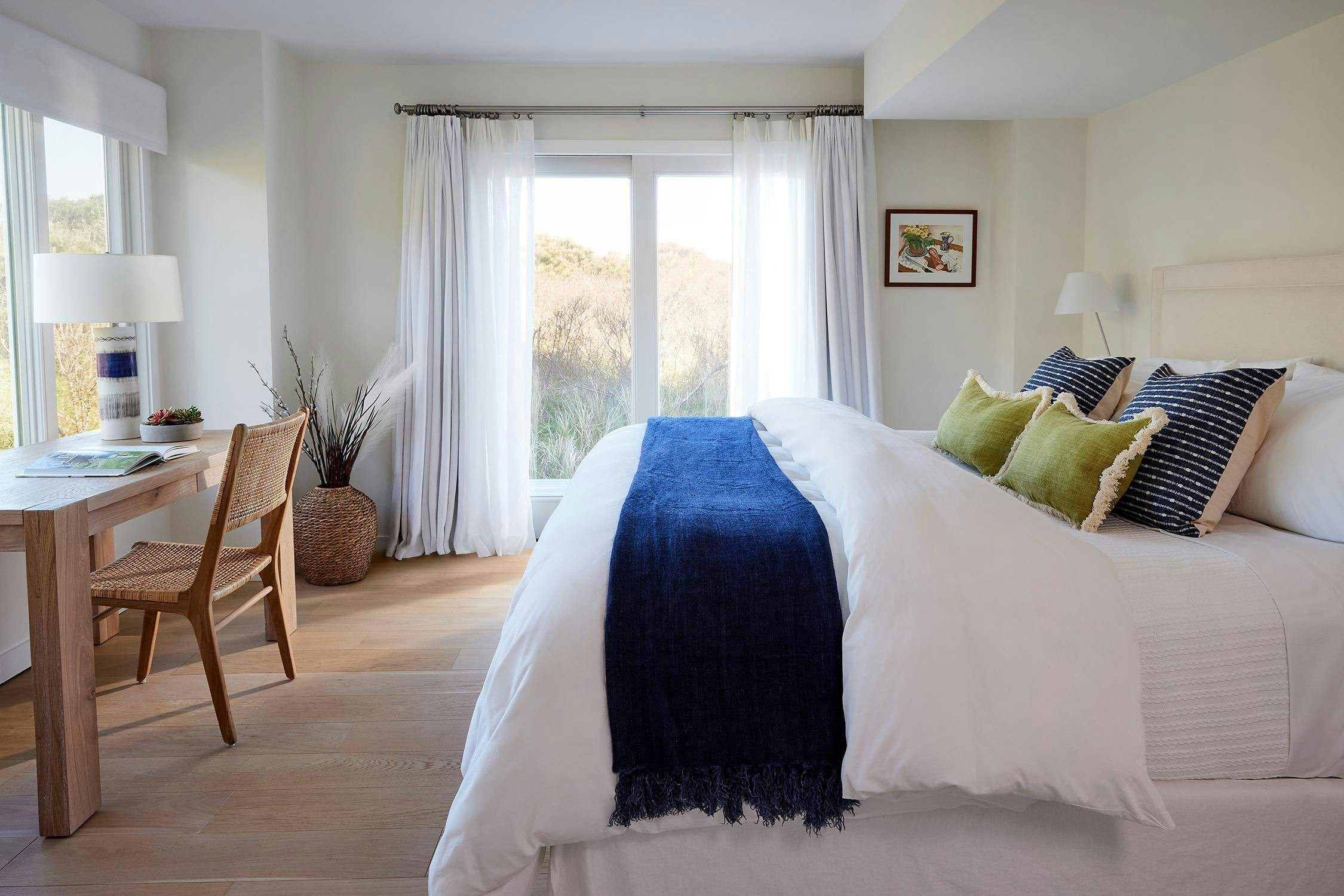 A coastal style bedroom in the Hamptons designed by Natura Interiors
