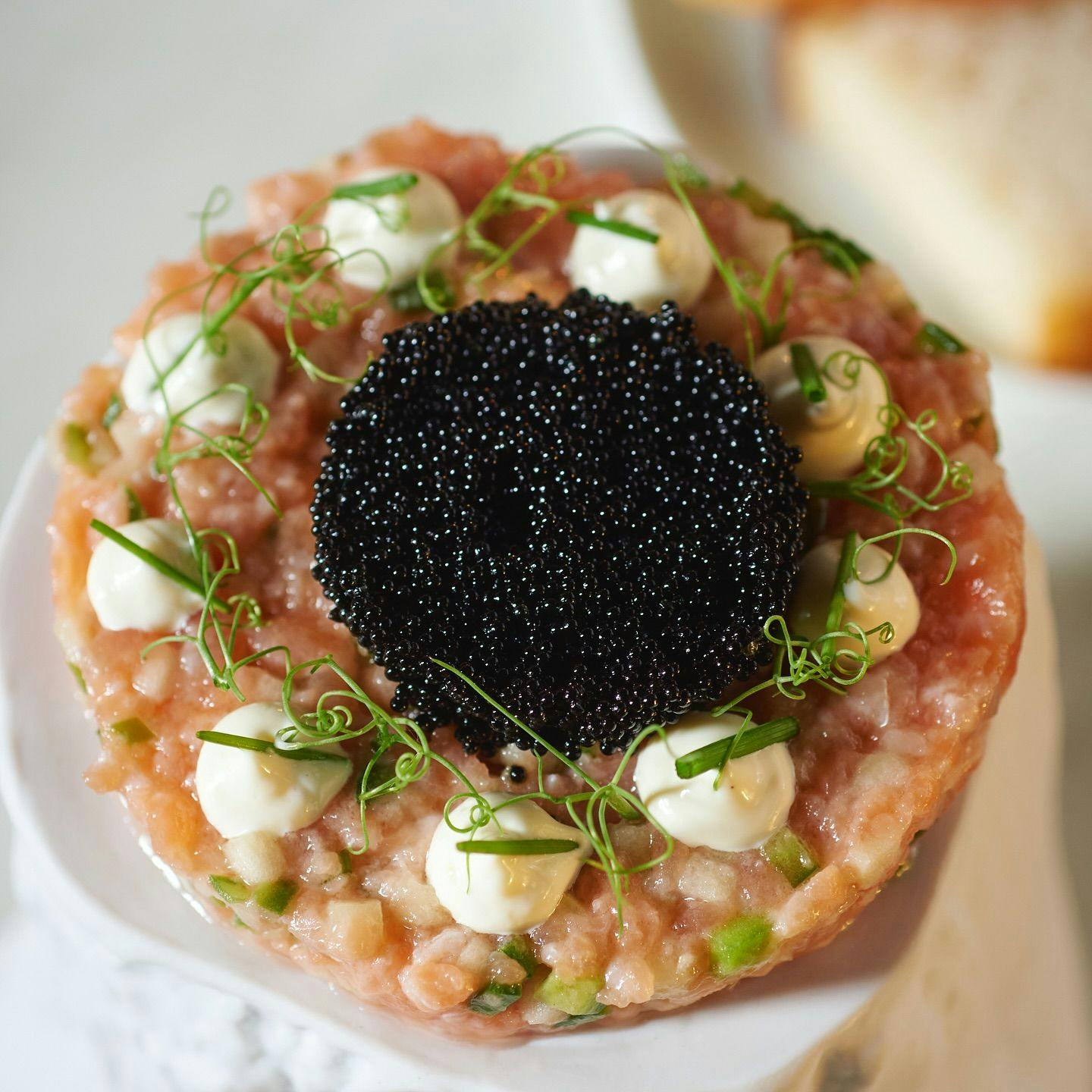 A beautiful caviar dish served beautifully at R.AIRE at the Hampton MaiD